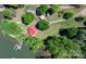 Aerial shot showcasing the property's layout, lake access, and wooded surroundings with boundary lines at 4599 B & C Dr, Catawba, NC 28609