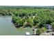 Gorgeous aerial view highlighting the waterfront home with its private dock on a serene lake at 4599 B & C Dr, Catawba, NC 28609