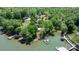 An aerial view of a lakefront property with a charming red-roofed house at 4599 B & C Dr, Catawba, NC 28609