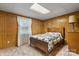Cozy bedroom featuring paneled walls, soft carpeting, and a window to enjoy some natural light at 4599 B & C Dr, Catawba, NC 28609
