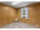 Neutral bedroom featuring paneled walls, soft carpeting, and a window to enjoy some natural light at 4599 B & C Dr, Catawba, NC 28609