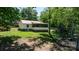 View of back exterior with screened in porch of lake house with a red roof at 4599 B & C Dr, Catawba, NC 28609