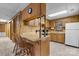 Functional kitchen with wood cabinets, breakfast bar, and essential appliances at 4599 B & C Dr, Catawba, NC 28609