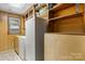 Functional laundry room with washer and dryer, complemented by ample shelving for organized storage solutions at 4599 B & C Dr, Catawba, NC 28609
