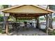 This covered structure on the water features picnic tables and seating, perfect for outdoor gatherings and lakeside dining at 4599 B & C Dr, Catawba, NC 28609