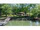 Lakefront home with private dock and waterfront gazebo, surrounded by lush trees at 4599 B & C Dr, Catawba, NC 28609