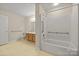 Full bathroom with tub and shower combination, wood vanity, and safety bars at 505 2Nd Street Ne Pl # B2, Conover, NC 28613
