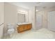 Bathroom with wood vanity, a decorative light fixture, and a toilet at 505 2Nd Street Ne Pl # B2, Conover, NC 28613