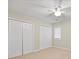 Neutral bedroom featuring double closets and a ceiling fan at 505 2Nd Street Ne Pl # B2, Conover, NC 28613