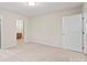 Spacious bedroom featuring neutral carpet and doorways to the bathroom and closet at 505 2Nd Street Ne Pl # B2, Conover, NC 28613