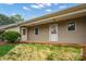 Tan siding home with a covered front porch and a tidy front lawn at 505 2Nd Street Ne Pl # B2, Conover, NC 28613