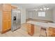 Kitchen featuring stainless steel refrigerator, wood cabinets, and modern countertops at 505 2Nd Street Ne Pl # B2, Conover, NC 28613