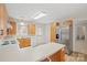 Bright kitchen with wood cabinets, stainless steel refrigerator, and modern appliances at 505 2Nd Street Ne Pl # B2, Conover, NC 28613