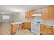 Kitchen featuring wood cabinets, modern lighting, and a breakfast bar with seating at 505 2Nd Street Ne Pl # B2, Conover, NC 28613