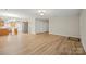 Open-concept space with updated floors, seamlessly connecting living and kitchen areas at 505 2Nd Street Ne Pl # B2, Conover, NC 28613