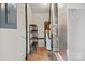 Utility room with water heater, shelves, and electrical panel at 505 2Nd Street Ne Pl # B2, Conover, NC 28613