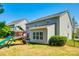 Well-maintained backyard with a play set and green grass at 5070 Saint Clair St, Fort Mill, SC 29715