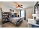 Cozy bedroom with Star Wars decor, a ceiling fan, natural light, and a charming desk setup at 5070 Saint Clair St, Fort Mill, SC 29715