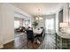 Open concept dining area that opens to the living room with hardwood flooring at 5070 Saint Clair St, Fort Mill, SC 29715