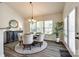 Bright dining room with natural light, modern chandelier, and stylish furniture at 5070 Saint Clair St, Fort Mill, SC 29715