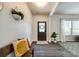 Inviting entryway featuring dark wood floors, a decorative wreath, and natural light at 5070 Saint Clair St, Fort Mill, SC 29715
