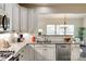 Kitchen features granite countertops, stainless appliances, and white cabinets at 5070 Saint Clair St, Fort Mill, SC 29715