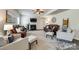 Cozy living room with fireplace, ceiling fan and comfortable leather seating at 5070 Saint Clair St, Fort Mill, SC 29715