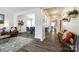 Open-concept living space with dark wood floors and a view of the dining area at 5070 Saint Clair St, Fort Mill, SC 29715