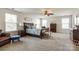 Expansive primary bedroom features a ceiling fan, natural light, and ample space for relaxation at 5070 Saint Clair St, Fort Mill, SC 29715