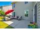 Relaxing outdoor patio with comfortable seating and a red umbrella at 5070 Saint Clair St, Fort Mill, SC 29715