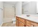 Traditional bathroom with a shower-tub combination and wooden vanity at 5114 Daffodil Ln, Concord, NC 28025
