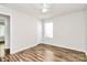 Bright bedroom with hardwood flooring, ceiling fan and a window at 5114 Daffodil Ln, Concord, NC 28025