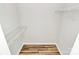 Walk-in closet with hardwood floor and wire shelving at 5114 Daffodil Ln, Concord, NC 28025