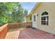 View of the deck, side of house, and well-kept yard and lawn at 5114 Daffodil Ln, Concord, NC 28025