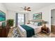 Cozy bedroom with a ceiling fan, natural light, and stylish decor at 5114 Daffodil Ln, Concord, NC 28025