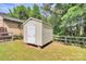 Exterior view of the storage shed in the backyard with well-kept grass at 5114 Daffodil Ln, Concord, NC 28025