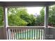Balcony view of the swimming pool and lush green trees around the building at 525 N Graham St, Charlotte, NC 28202