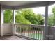 Balcony view of the swimming pool and lush green trees around the building at 525 N Graham St, Charlotte, NC 28202