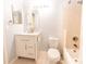 Clean bathroom with vanity, mirror, and tiled shower-tub combo at 525 N Graham St, Charlotte, NC 28202