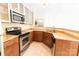 Well-lit kitchen featuring stainless steel appliances and granite countertops at 525 N Graham St, Charlotte, NC 28202
