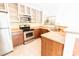 Modern kitchen featuring stainless steel appliances, tile flooring and granite countertops at 525 N Graham St, Charlotte, NC 28202