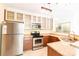 Modern kitchen featuring stainless steel appliances, granite countertops, and ample cabinetry at 525 N Graham St, Charlotte, NC 28202
