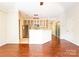 Bright living room with hardwood floors and eat-in kitchen at 525 N Graham St, Charlotte, NC 28202