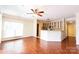 Open-concept living room with hardwood floors and an eat-in kitchen at 525 N Graham St, Charlotte, NC 28202