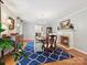 Bright dining room with a fireplace and view to the entryway at 5624 Warewhip Ln, Charlotte, NC 28210