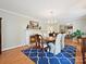 Elegant dining room featuring a fireplace, hardwood floors and bright natural light at 5624 Warewhip Ln, Charlotte, NC 28210