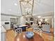 Open eat-in kitchen features stainless appliances and views to the living room and fireplace beyond at 5624 Warewhip Ln, Charlotte, NC 28210