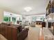 Open living room with fireplace, hardwood floors, and an open-concept design at 5624 Warewhip Ln, Charlotte, NC 28210
