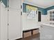 Inviting mudroom with built-in bench, storage cabinets, and stylish decor at 5624 Warewhip Ln, Charlotte, NC 28210