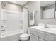 Well-lit bathroom featuring a shower-tub combination, white vanity, and neutral paint at 5722 Knox Ln, Kannapolis, NC 28081